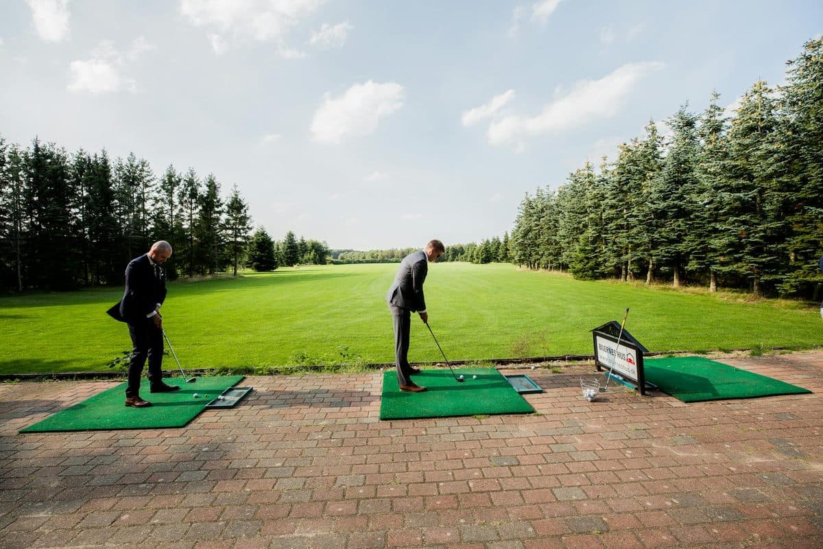 Business colleagues enjoying a corporate golf experience day on the course