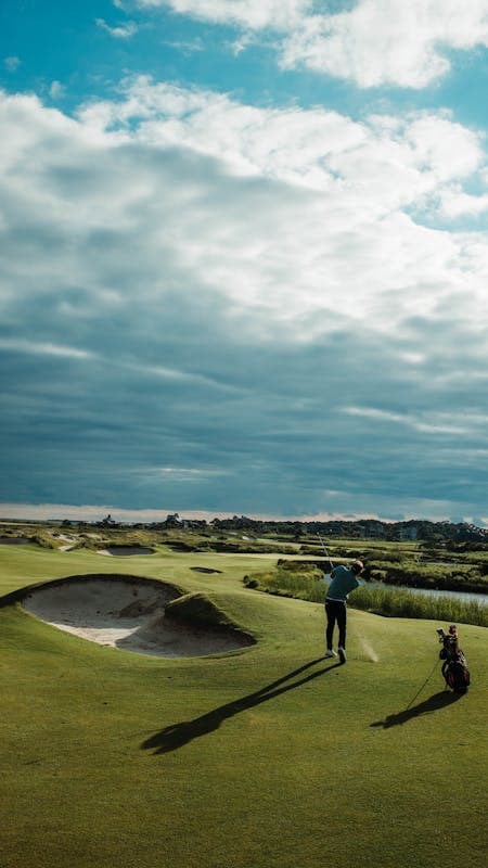 Golfer playing on a coastal links course